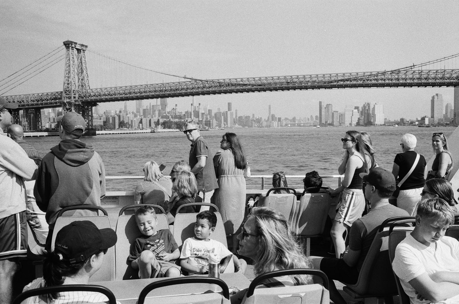 Williamsburg Bridge and Manhattan skyline seen from the water, Brooklyn, black-and-white photograph